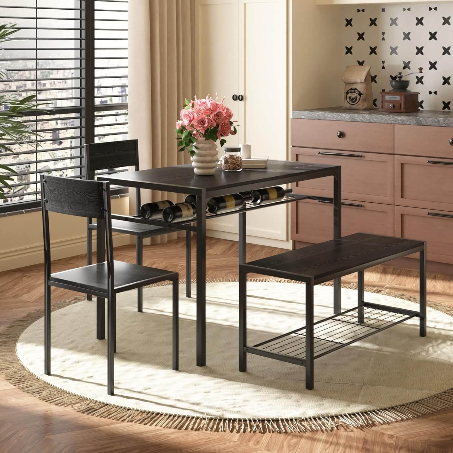 Industrial style kitchen dining set with black table, two chairs, and bench in a warm kitchen setting.