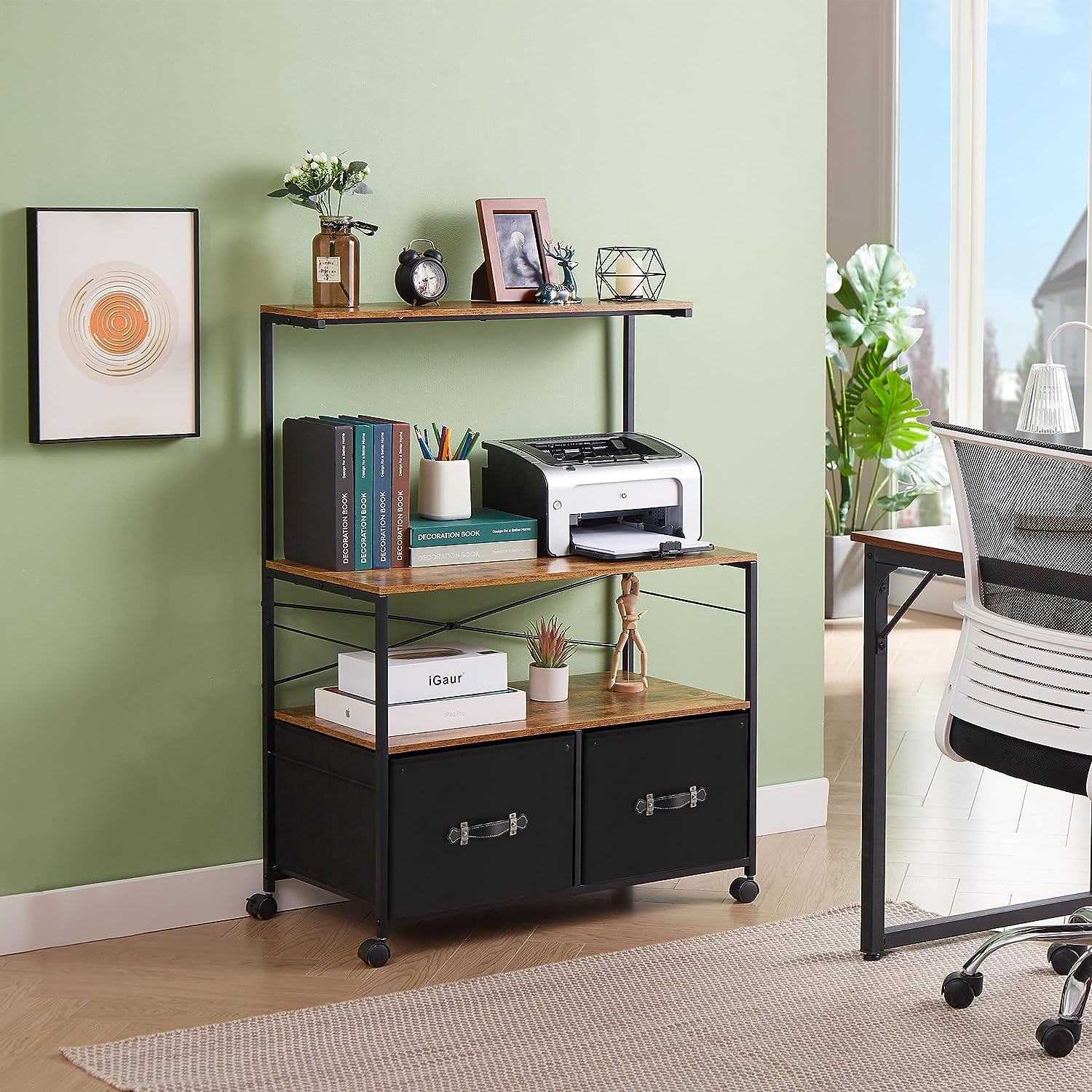 Industrial-style printer stand with wood shelves, black metal frame, and rolling wheels, featuring books, decor, and storage bins in a modern home office setting.